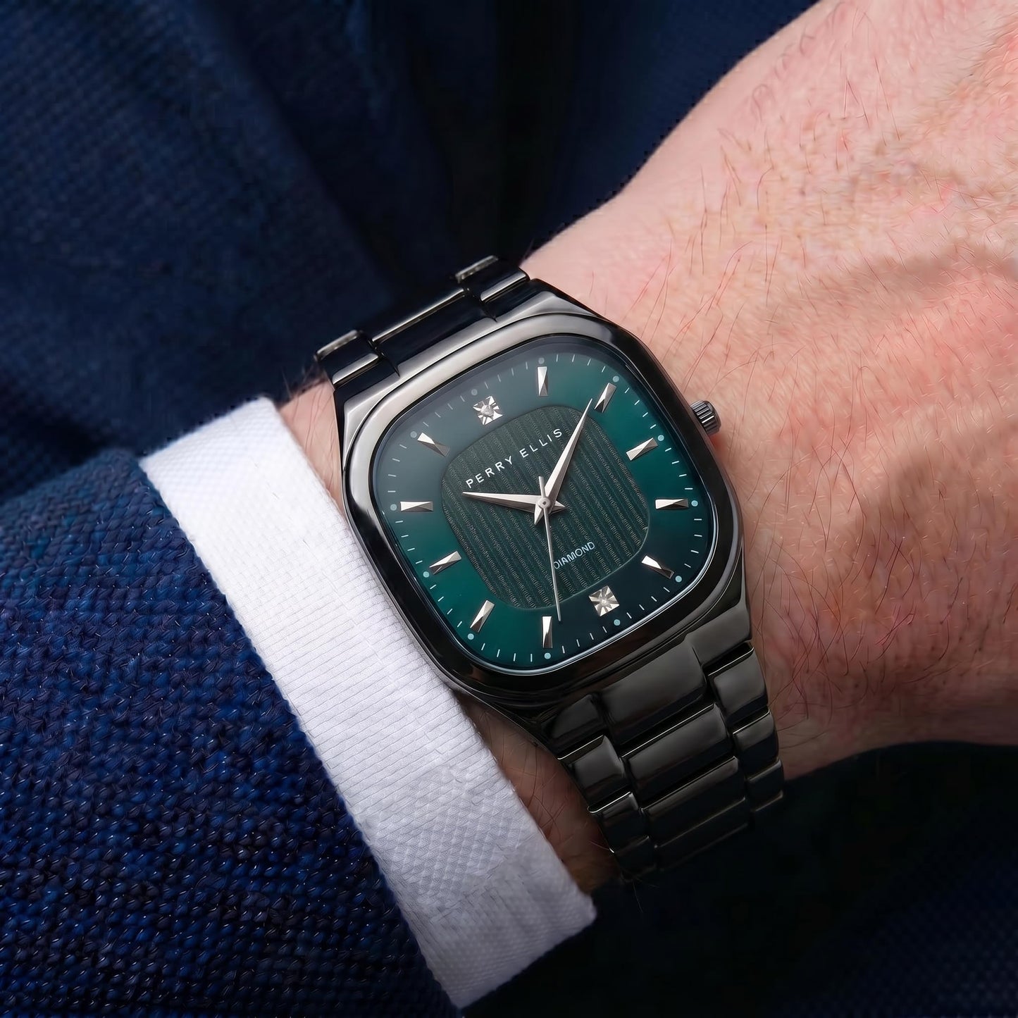 Perry Ellis Ultra Slim Men’s Watch – Cushion Light Gun 40mm Case, Teal Blue Hydraulic Press Center Dial with Sunray Finish, Two 0.9mm Diamond Accents, Silver Faceted Indexes, Alloy Bracelet